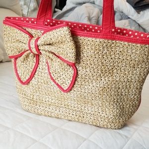 Bueno straw like material with red trim